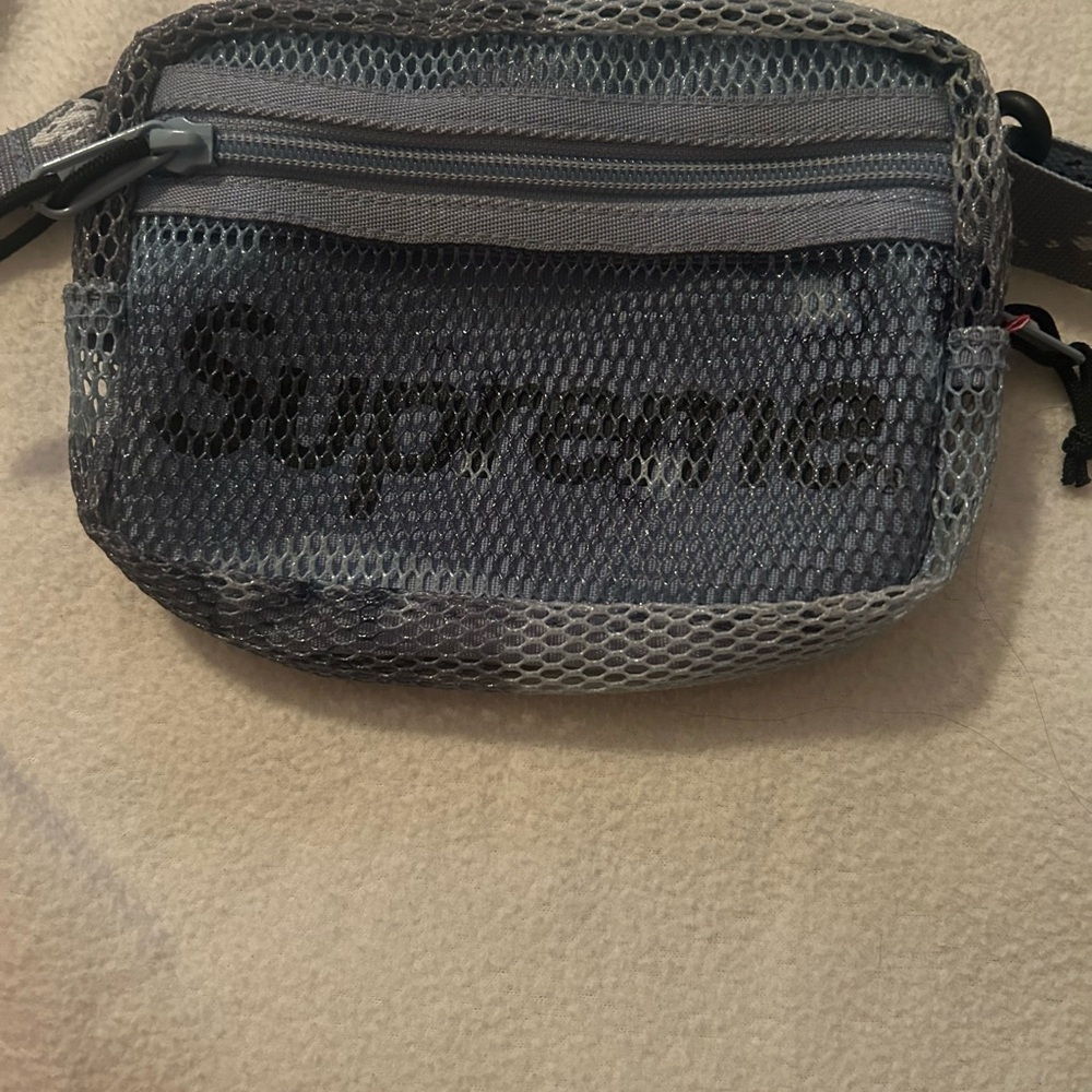 Supreme blue camo. Use as a shoulder bag or around the waist. Used once. Unisex